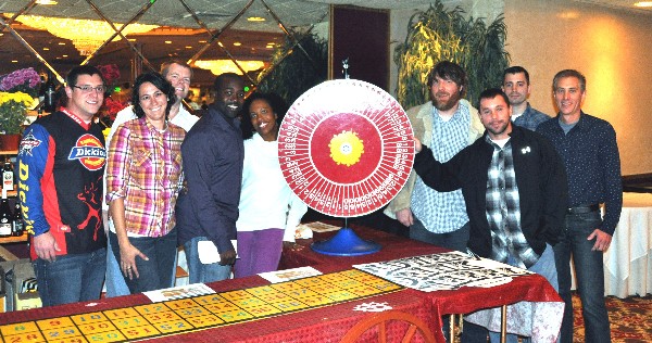 Volunteers assist with the Northrop Grumman-sponsored flower and beverage wheel at the chapter’s Bull & Oyster Roast in November, which raise more than $40,000 in scholarship funds.